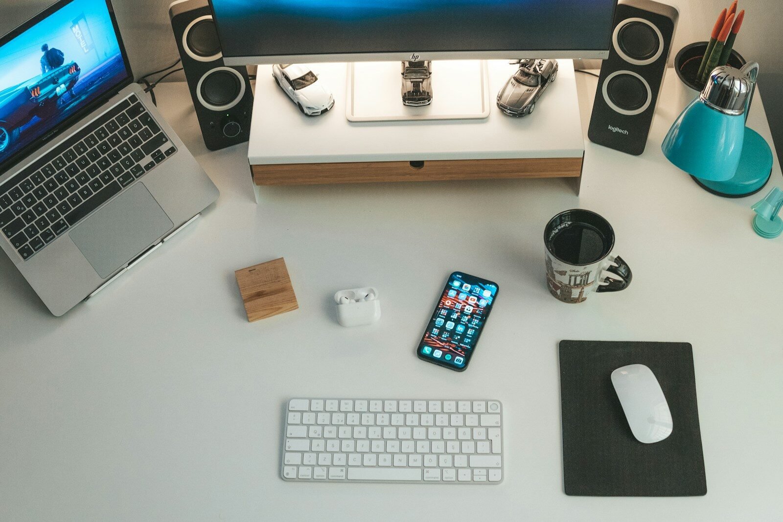 a laptop and a cell phone on a desk